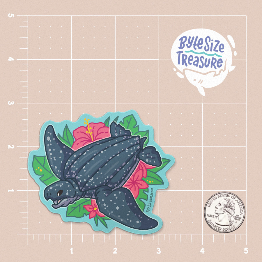 A sticker of a leatherback sea turtle with tropical flowers - shown on a tan measuring grid background with a quarter for scale. Art by Byte Size Treasure